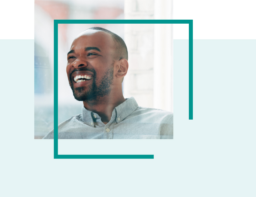Young man laughing in the workplace